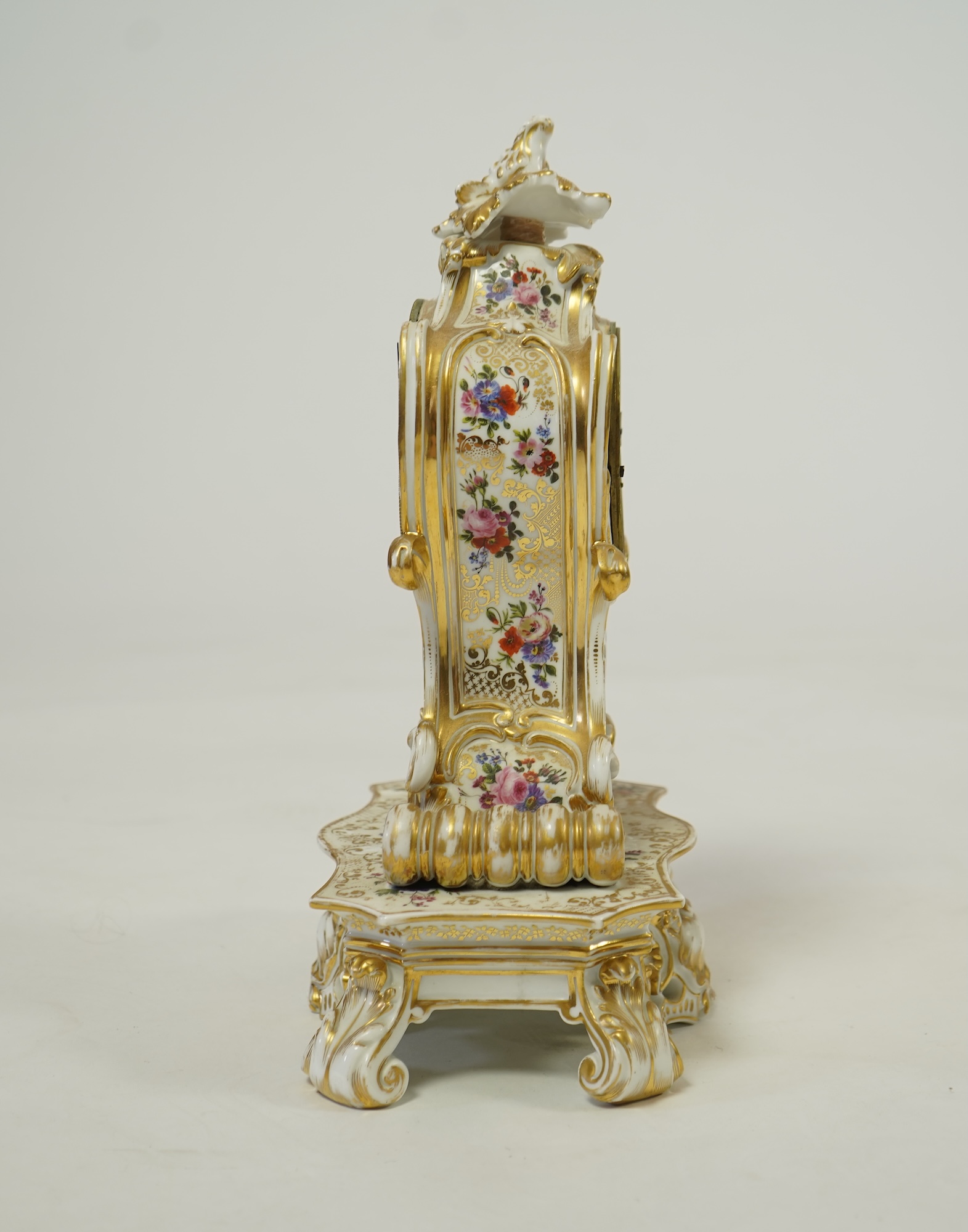 A mid 19th century French porcelain floral and gilt decorated clock, by Jacob Petit